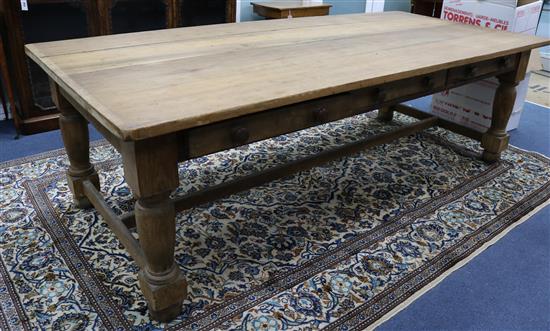 A large pine three drawer kitchen table W.244cm